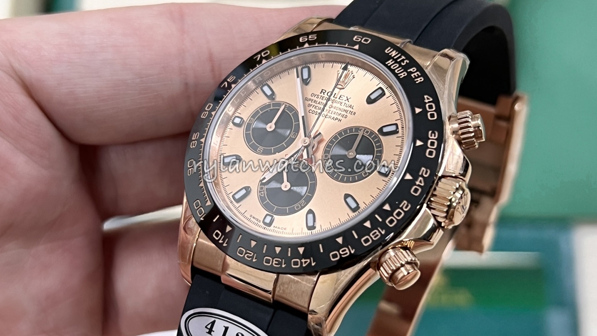 Rolex Daytona rubber strap watch with tachymeter bezel and chronograph dial